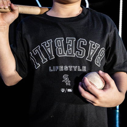 Youth model wearing black youth graphic tee with "Chicago White Sox Upside Down" design