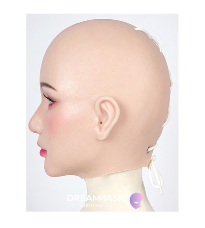 Realistic silicone female mask with lace-back design, detailed makeup, and visible eye pupils by InTheMask.