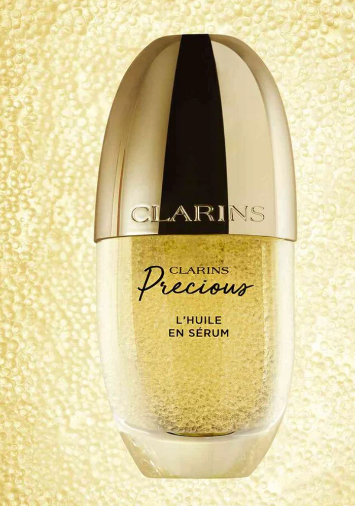 Clarins Precious L’Huile en Sérum face oil serum in 30ml bottle, highlighting its elegant packaging and luxurious skincare formula.