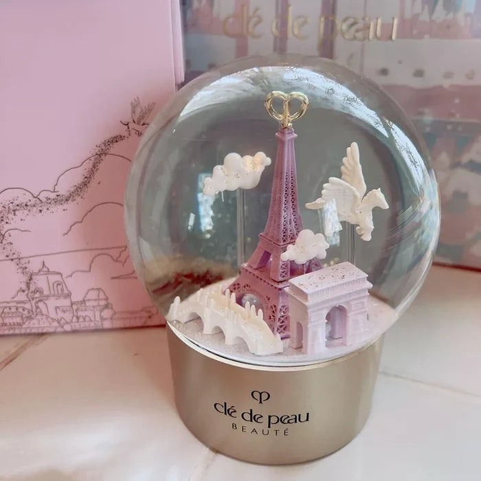 Cle de Peau Beauté Holiday Limited Edition Snow Globe, new in box, decorative home accessory with elegant design and winter scene.