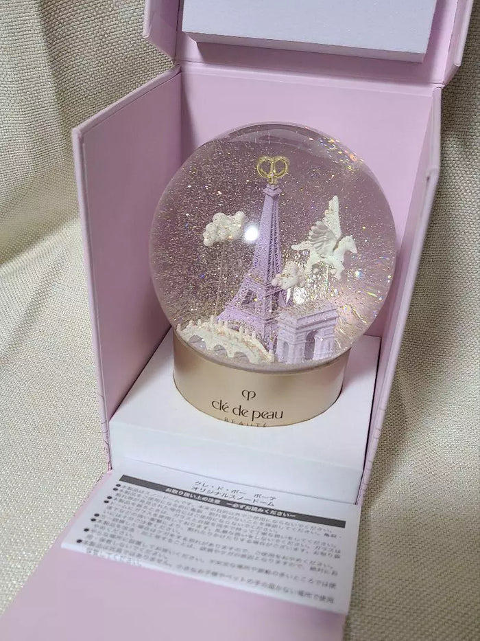 Clé de Peau Beauté Holiday Limited Edition Snow Globe, new in box, decorative home accessory with elegant design.