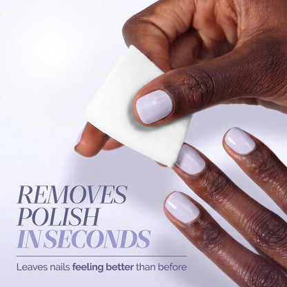 A hand uses a LONDONTOWN Conditioning Lacquer Remover Pad to easily wipe away light nail polish from fingernails. Text reads: "Removes polish in seconds. Leaves nails feeling better than before—perfect for convenient on-the-go nail polish removal.
