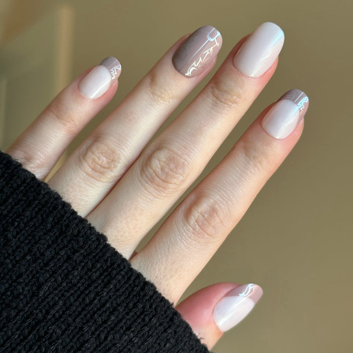 Cowboy Boot Chrome | Short | Round - Tab Press-On nails with soft chrome shimmer and subtle western boot pattern for easy at-home mani