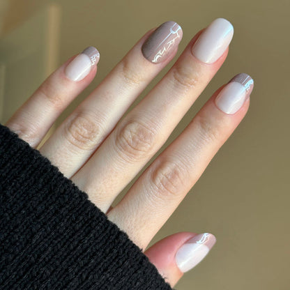 Cowboy Boot Chrome | Short | Round - Tab Press-On nails with soft chrome shimmer and subtle western boot pattern for easy at-home mani