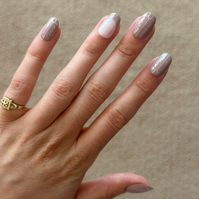 Cowboy Boot Chrome | Short | Round - Tab Press-On nails featuring shimmery chrome with subtle western boot design for an easy mani