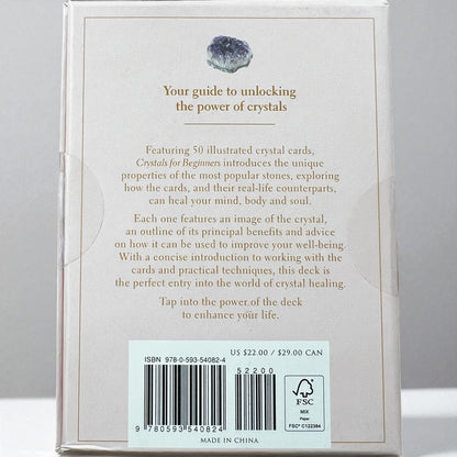 Card deck packaging titled 'Crystals for Beginners' by Judy Hall on a white background, Raven's Cauldron, 6 N Sandusky St, Delaware, OH 43015