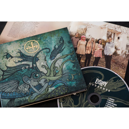 Teal colored square CD with a large fish in the center. Surrounding it are other sea creatures swimming in its direction. Across the top of the fish, there is white text that says CURRENTS. Above that is a yellow circle with text on the inside that says EISLEY. To the right of the cover is a disc, with EISLEY written on top in white text, and CURRENTS written below it.