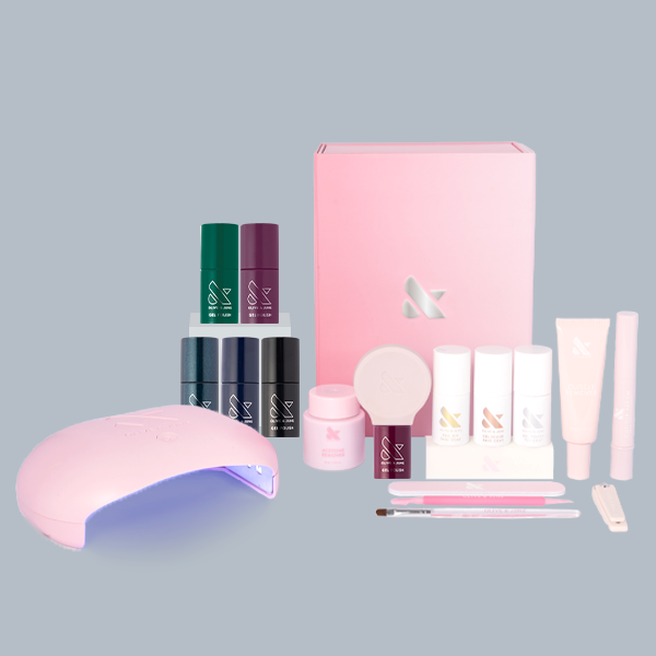 Dark & Moody Gel System with six dark gel polishes, nail care tools, and a pink curing lamp for at home manicures