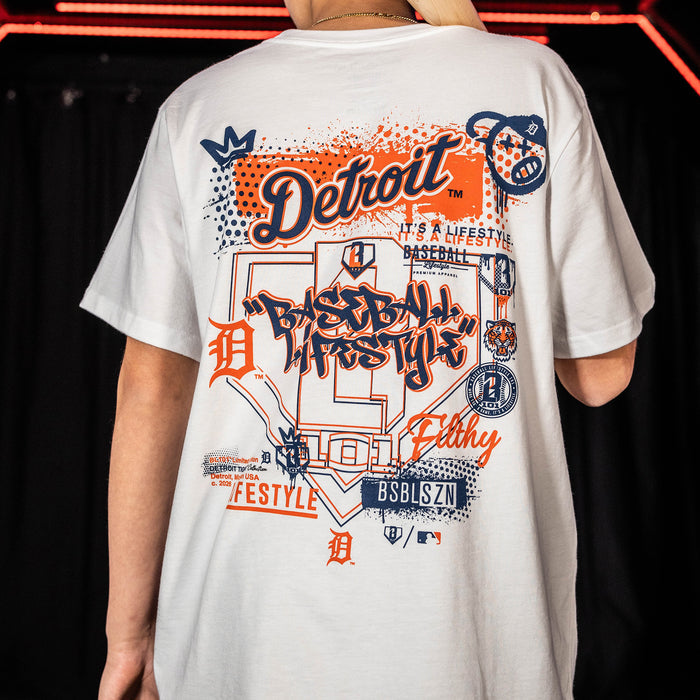 Youth model wearing white youth graphic tee with "Detroit Tigers Drip" design