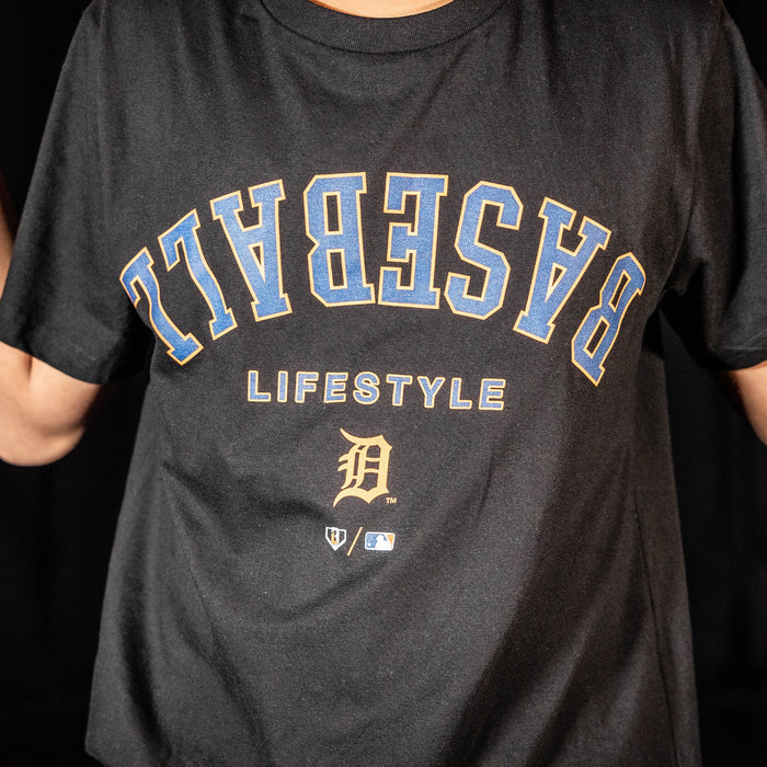 Youth model wearing black youth graphic tee with "Detroit Tigers Upside Down" design