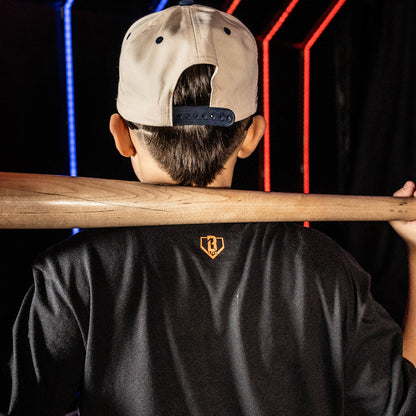 Youth model wearing black youth graphic tee with "Detroit Tigers Upside Down" design