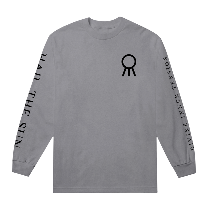 A gray Hail The Sun Comfort Colors long-sleeve shirt with a black abstract circular symbol on the chest. "HAIL THE SUN" is printed on the left sleeve and "DIVINE INNER TENSION" in bold black letters on the right.