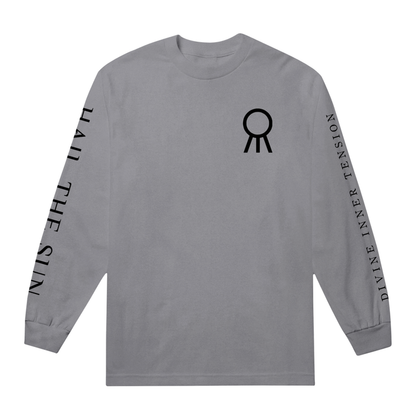 A gray Hail The Sun Comfort Colors long-sleeve shirt with a black abstract circular symbol on the chest. "HAIL THE SUN" is printed on the left sleeve and "DIVINE INNER TENSION" in bold black letters on the right.