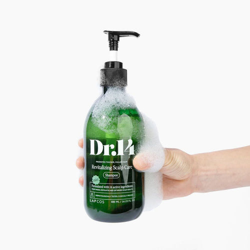Foamy hand holding Dr.14 Revitalizing Scalp Care Shampoo for thinning hair, with biotin