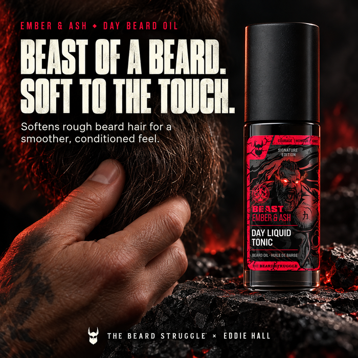 Beast Ember & Ash Day Liquid Tonic beard oil bottle beside a hand gripping a dark beard, headline Beast of a Beard Soft to the Touch