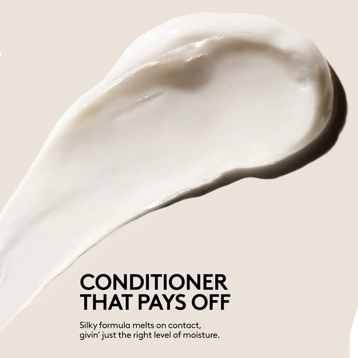 Fenty Beauty The Rich One Moisture Repair Conditioner for fine to medium hair, 10oz, creamy formula in a sleek bottle.