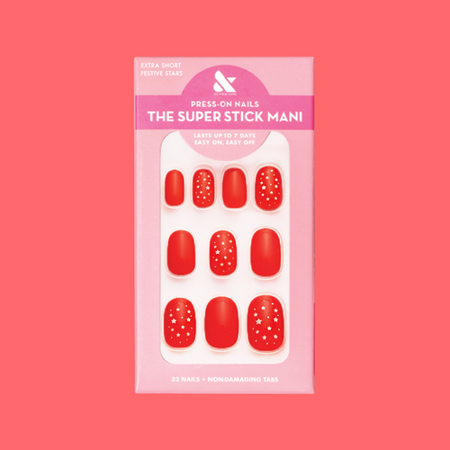 Festive Stars | Extra Short | Round - Tab Press-On nails in bright red with small white star accents in retail packaging