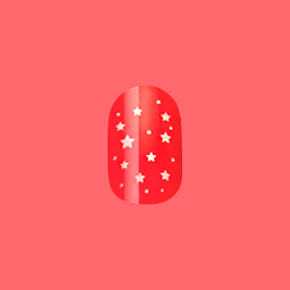 Festive Stars | Extra Short | Round - Tab Press-On nail in bright red with small white star pattern on coral background