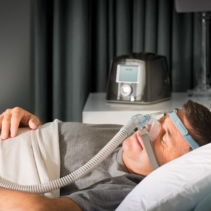 man Wearing Eson 2 Nasal CPAP Mask in Bed