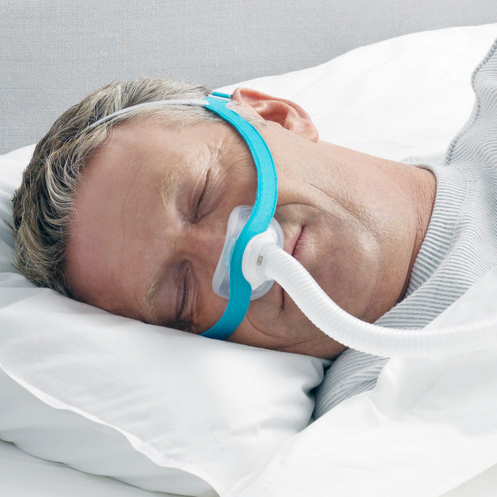 Man Sleeping with an Evora Nasal CPAP mask