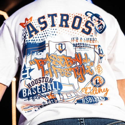 Youth model wearing white youth graphic tee with "Houston Astros Drip" design