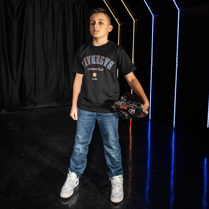 Youth model wearing black youth graphic tee with "Houston Astros Upside Down" design