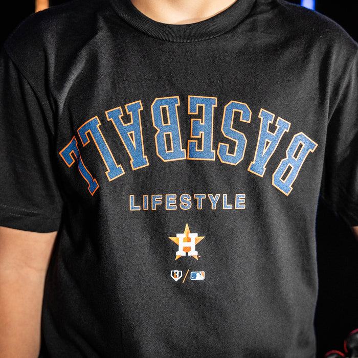 Youth model wearing black youth graphic tee with "Houston Astros Upside Down" design