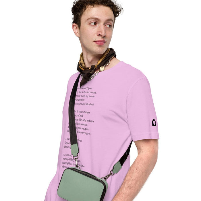 Model wearing lilac unisex t-shirt featuring Leo Herrera's queer poem "Gumballs" in black text, Adam's Nest Provincetown