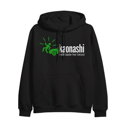 A black hoodie with a green figure being hit by a green car has the white words "kaonashi; I still taste her blood" on it.