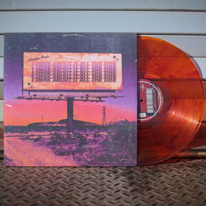 A vibrant Yellow/Orange Marble Limited Edition Vinyl from Shallow Pools partially slides out of a pink-purple album cover featuring a sunset-lit billboard reading THINK ABOUT IT ALL THE TIME, with hills and power lines in the background.