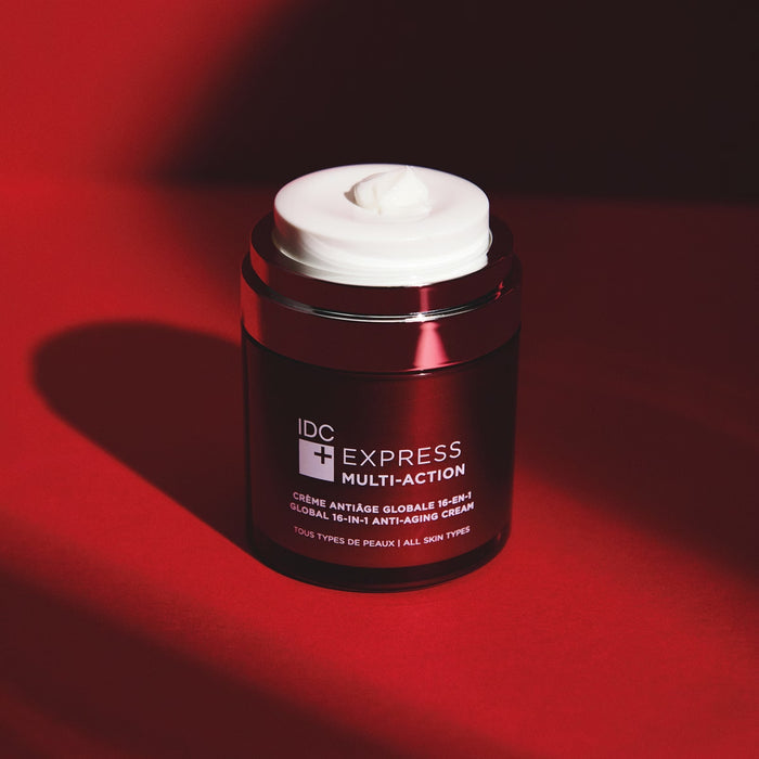 IDC Express Multi-Action Cream in 50ml jar, beauty skincare product with smooth, creamy texture and IDC branding visible.