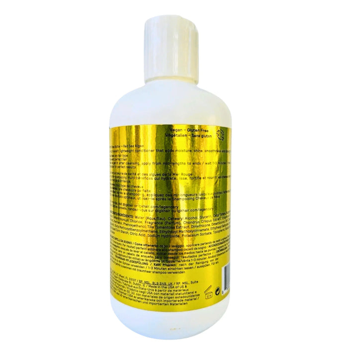 Back of a white bottle with gold label, text showing vegan, gluten-free hair conditioner