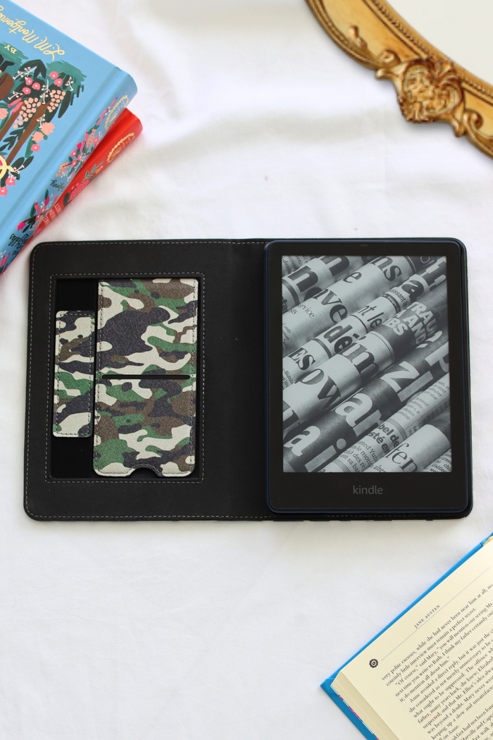 Black leather kindle case with camouflage pattern and on a white surface