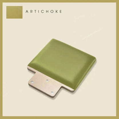 Padded jump board in Artichoke green with a sleek, minimalistic design on a light beige background.