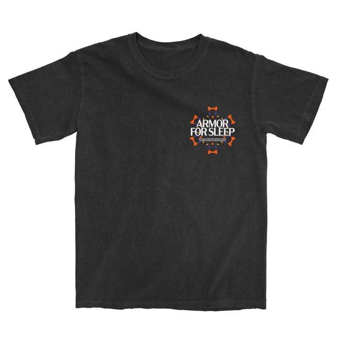 A black Comfort Colors t-shirt by Armor For Sleep with an orange and white design on the left chest, surrounded by small orange shield icons.