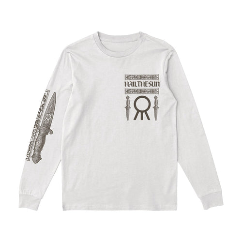 A white long-sleeve Hail The Sun shirt with the bands name and two knife graphics on the chest, a large circular symbol below, and a detailed dagger design on the right sleeve.
