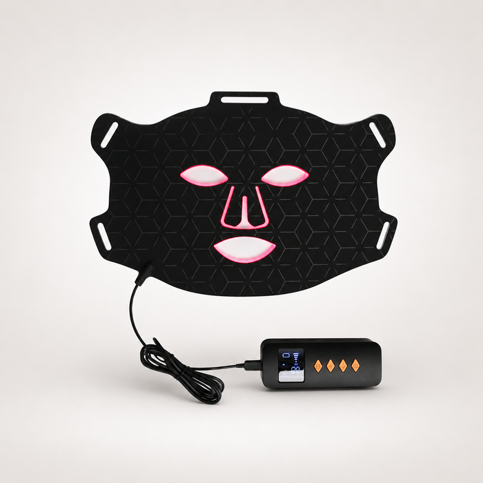Professional LED red light therapy face mask with handheld controller on light background