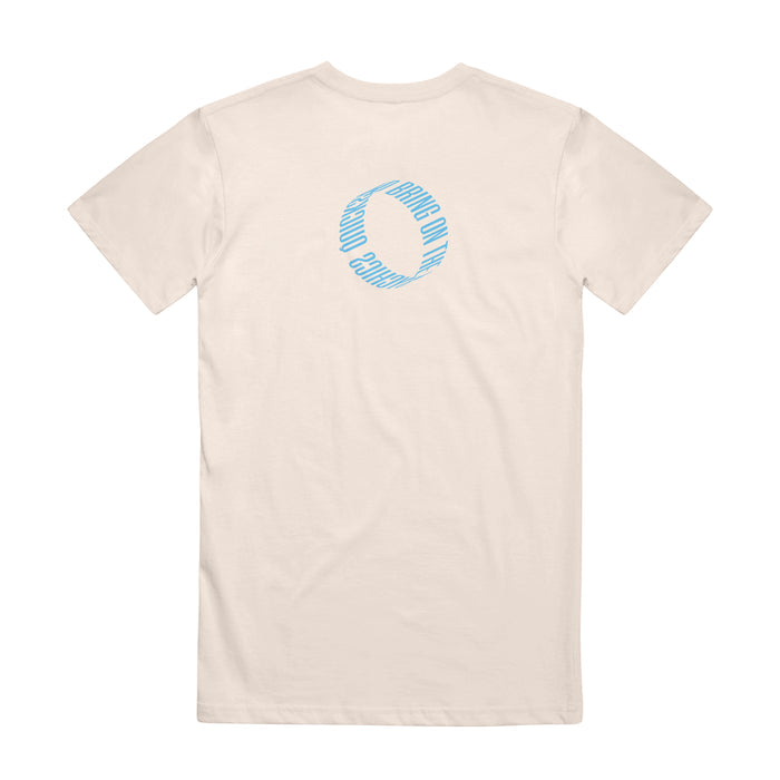 A white Quicksand Comfort Colors t-shirt, shown from the back, displays a small blue circular design by the neckline with "GOOD ONLY" repeated around the circle.