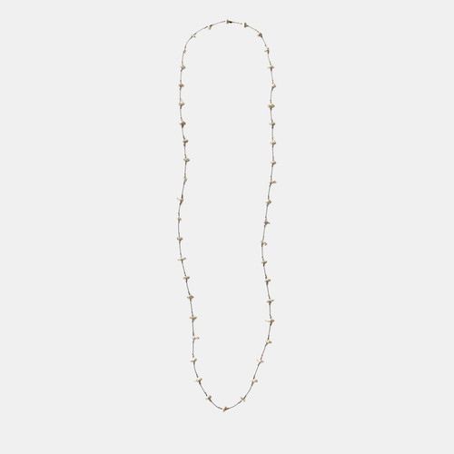 Long keshi pearl necklace with small white teardrop pearls on a thin gold-tone chain
