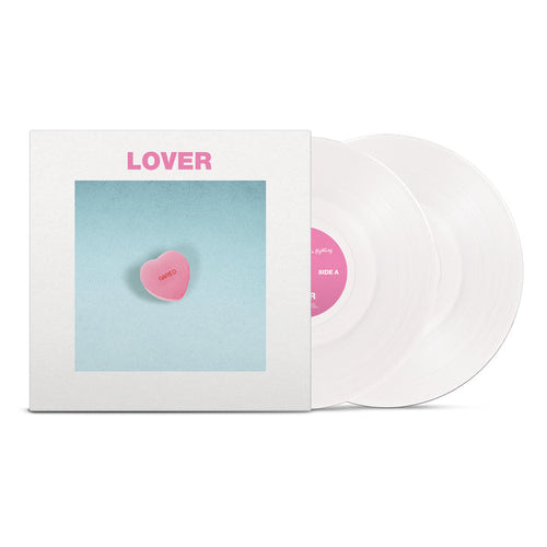 The Sound Of Animals Fighting’s Lover The Lord Has Left Us is a vinyl set with two opaque white discs. The cover shows a pink candy heart reading “Lover” on a blue background, white border, and the title in pink uppercase at the top.