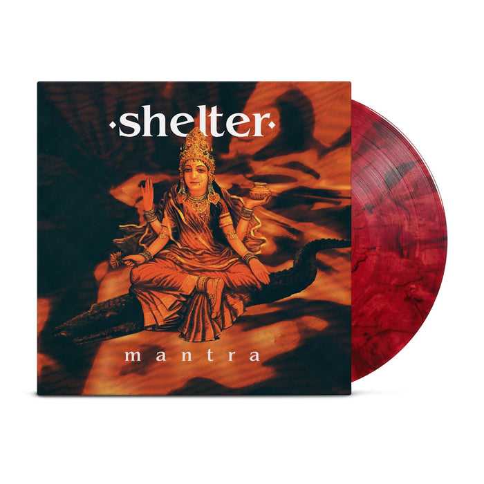 A red marbled hardcore vinyl record partially slides from its cover, which displays a four-armed Hindu goddess seated cross-legged, with "Shelter" as the band name above and the album title "Mantra" below her.