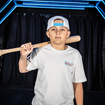Youth model wearing white youth graphic tee with "Miami Marlins Drip" design