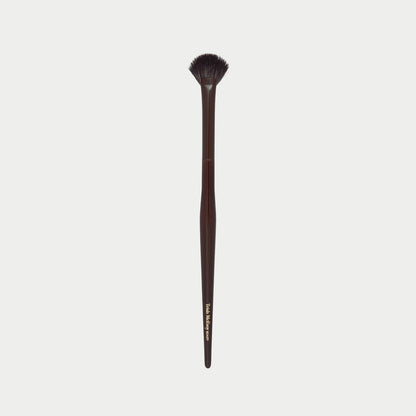 Makeup brush 63 with a wooden handle on a white background