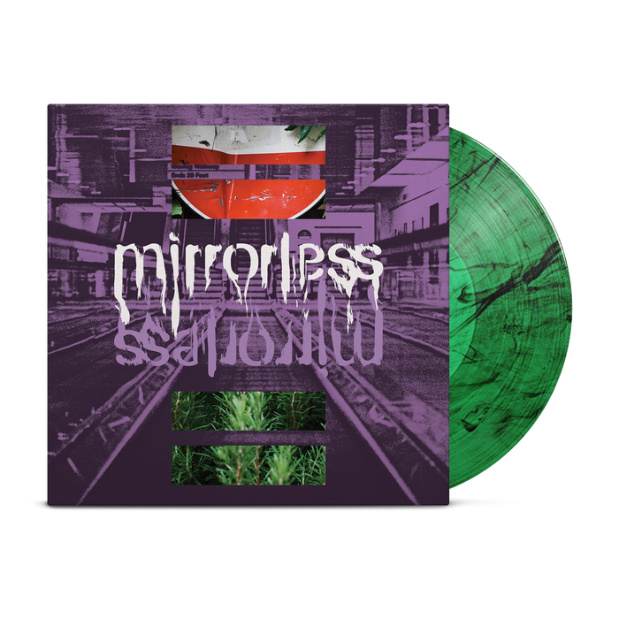 A green marbled vinyl record slides from a purple cover with glitch art, photos, and the MIRRORLESS brand name in white distorted text—mirrored below—offering a bold preview of the new album, out October 17th, 2025.