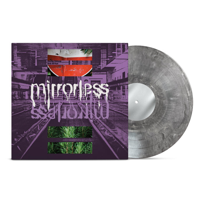A marbled Concrete Mix Vinyl LP partially slides out of an album cover with purple train tracks, abstract red and green art, and the brand name MIRRORLESS in distorted white text reflected underneath.