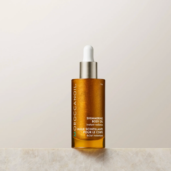 Moroccanoil Body Shimmering Body Oil 50ml bottle, smooth and radiant finish, with a sleek, elegant design and clear label.