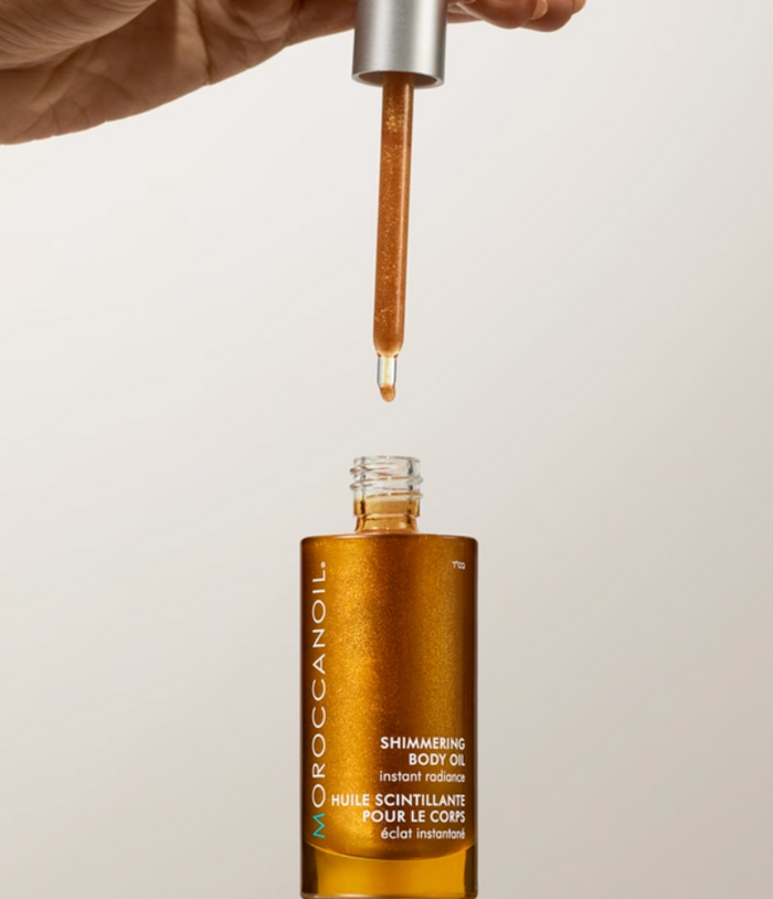 Moroccanoil Body Shimmering Body Oil 50ml bottle, smooth texture, luxurious finish, and shimmering glow for radiant skin.