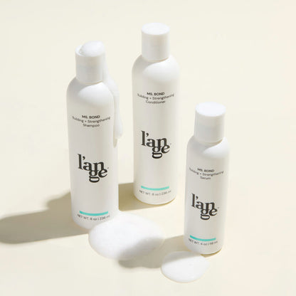 Ms. Bond System Value Set, featuring a Ms. Bond Shampoo, conditioner, and serum, displayed on a beige background