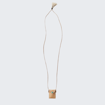 Tan leather amulet pouch on long cord with small tassel detail