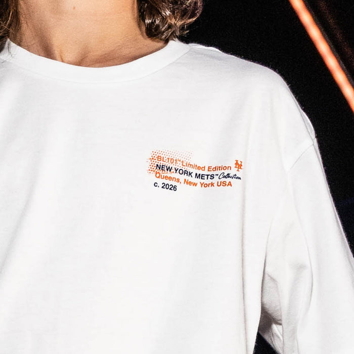 Youth model wearing white youth graphic tee with "New York Mets Drip" design